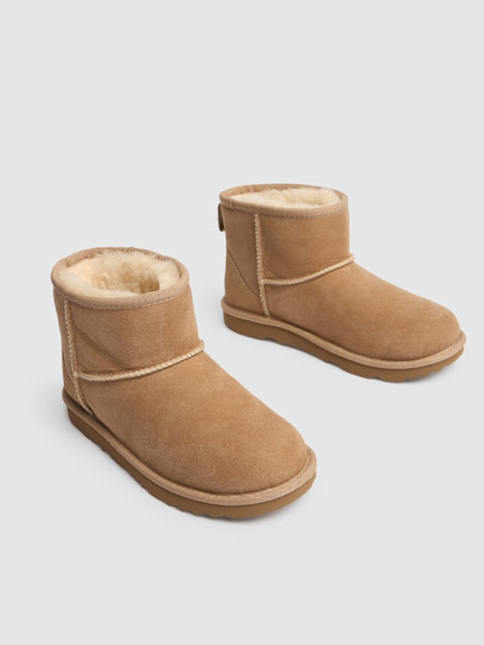 Luisaviaroma Stivali Classic Mini II in shearling Ritorno libero